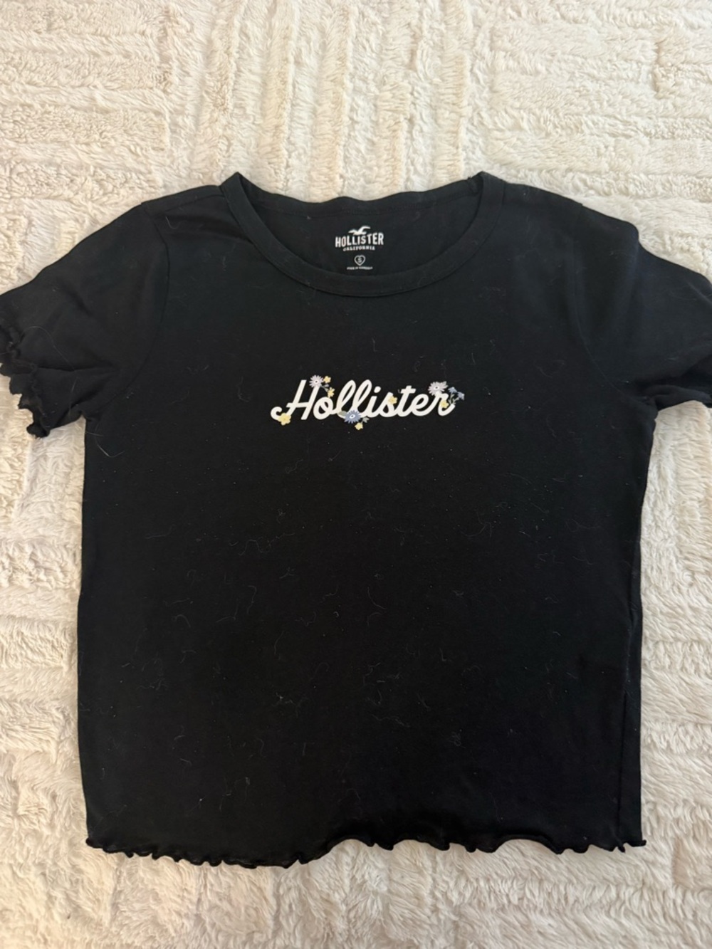 Hollister Black Logo Tee with Tiny Floral Accents